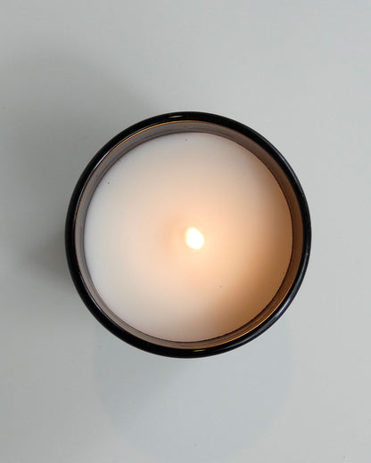 dolca aroom 5.11oz scented candle, cristal saffron and jasmine scent, top view with candle lit